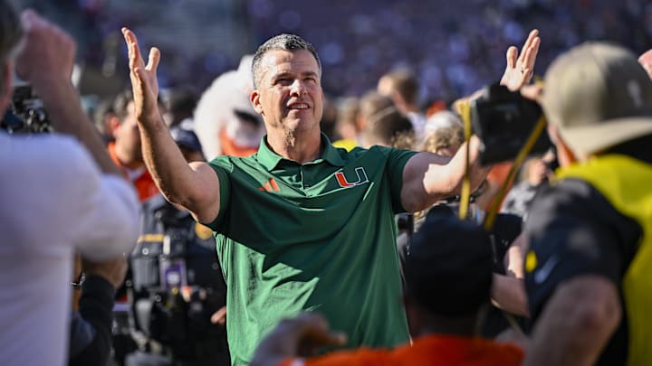 Dec 20, 2025; College Station, TX, USA; Miami Hurricanes head coach Mario Cristobal celebrates as he walks off the field after the Hurricanes win over the Texas A&M Aggies at Kyle Field. Mandatory Credit: Jerome Miron-Imagn Images