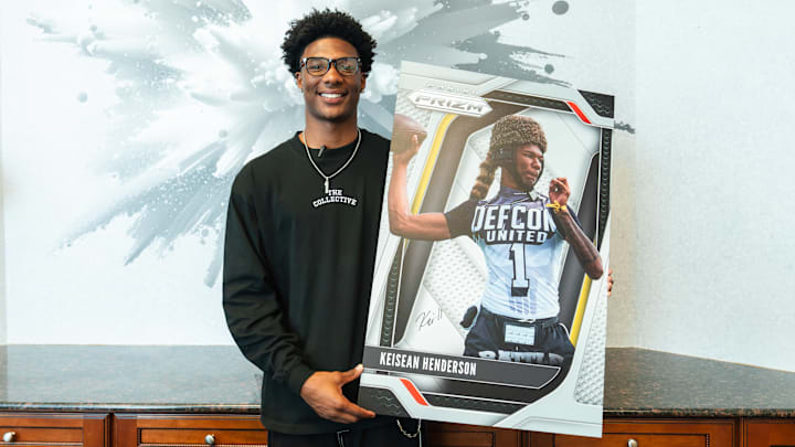 Houston Cougars Signee Keisean Henderson poses with his Panini player card.