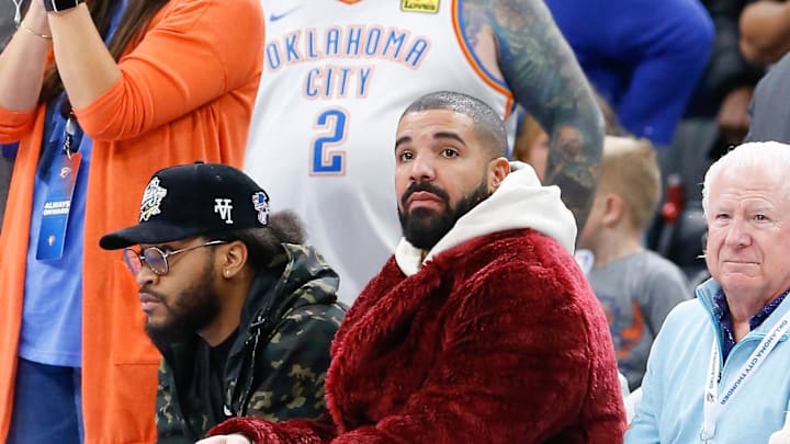Dec 1, 2021; Oklahoma City, Oklahoma, USA; Rapper, singer and actor Drake watches the Oklahoma City Thunder take on the Houston Rockets during the second half of an Oklahoma City Thunder game at Paycom Center.