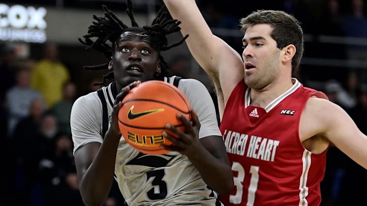 Dec 16, 2023; Providence, Rhode Island, USA; Providence Friars guard Garwey Dual (3) shoots the ball against Sacred Heart.