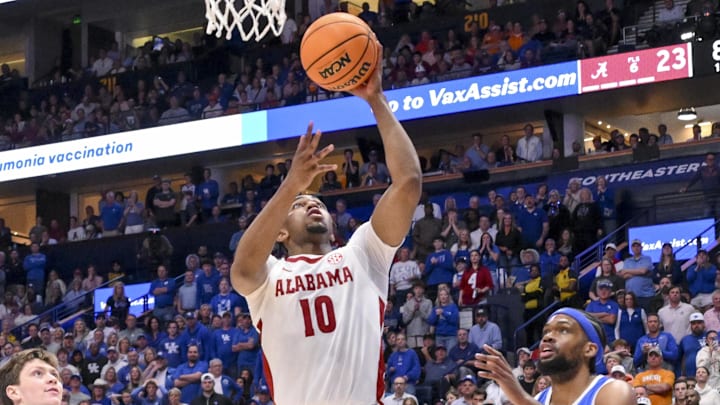 Mar 14, 2025; Nashville, TN, USA;  Alabama Crimson Tide forward Mouhamed Dioubate (10) lays the ball in against the Kentucky Wildcats during the first half at Bridgestone Arena. Mandatory Credit: Steve Roberts-Imagn Images
