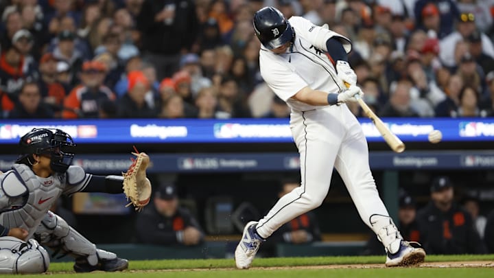Oct 10, 2024; Detroit, Michigan, USA; Detroit Tigers first base Spencer Torkelson (20) hits a single in the second inning against the Cleveland Guardians during game four of the ALDS for the 2024 MLB Playoffs at Comerica Park. Mandatory Credit: Rick Osentoski-Imagn Images