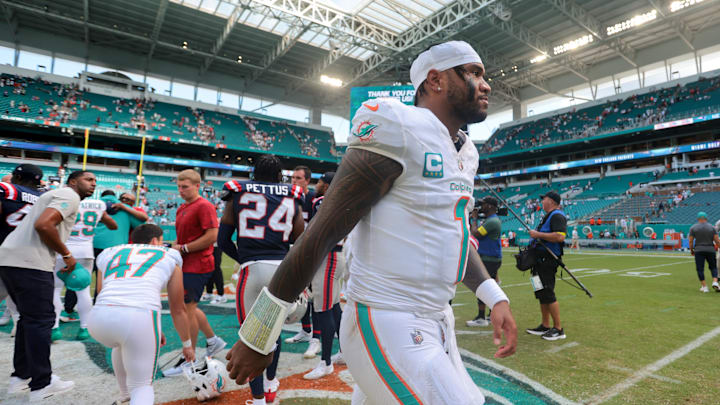 Miami Dolphins quarterback Tua Tagovailoa (1) walks off the field after the game against the New England Patriots at Hard Rock Stadium. Miami Dolphins quarterback Tua Tagovailoa (1) walks off the field after the game against the New England Patriots at Hard Rock Stadium.