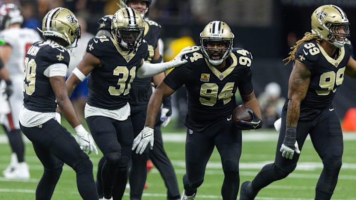 Oct 13, 2024; New Orleans, Louisiana, USA;  New Orleans Saints defensive end Cameron Jordan (94) intercepts Tampa Bay Buccaneers quarterback Baker Mayfield (6) during the first half at Caesars Superdome. Mandatory Credit: Stephen Lew-Imagn Images