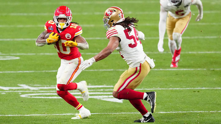 Feb 11, 2024; Paradise, Nevada, USA; Kansas City Chiefs running back Isiah Pacheco (10) runs against San Francisco 49ers linebacker Fred Warner (54) during overtime in Super Bowl LVIII at Allegiant Stadium. Mandatory Credit: Stephen R. Sylvanie-USA TODAY Sports