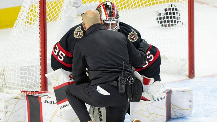 Oct 21, 2026; Ottawa, Ontario, CAN; Ottawa Senators Athletic Therapist Domenic Nicoletta checks on goalie Linus Ullmark (35) after he sustained an injury in the third period at the Canadian Tire Centre. Mandatory Credit: Marc DesRosiers-Imagn Oct 21, 2026; Ottawa, Ontario, CAN; Ottawa Senators Athletic Therapist Domenic Nicoletta checks on goalie Linus Ullmark (35) after he sustained an injury in the third period at the Canadian Tire Centre. Mandatory Credit: Marc DesRosiers-Imagn