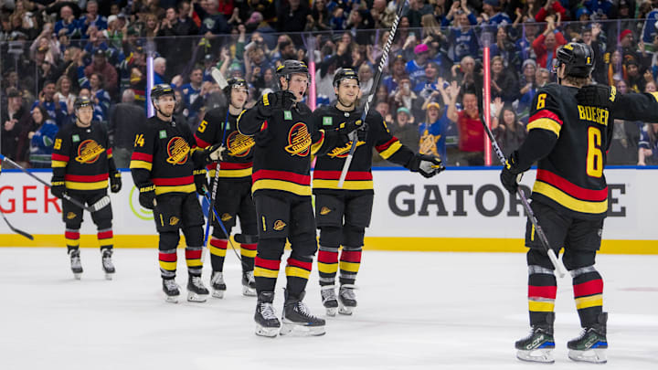 Jan 27, 2024; Vancouver, British Columbia, CAN; The Vancouver Canucks celebrate their victory
