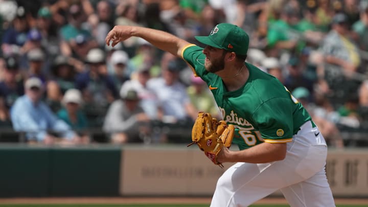 Mar 17, 2025; Mesa, Arizona, USA; Oakland Athletics pitcher Justin Sterner (60) throws against the Seattle Mariners in the first inning at Hohokam Stadium. Mandatory Credit: Rick Scuteri-Imagn Images