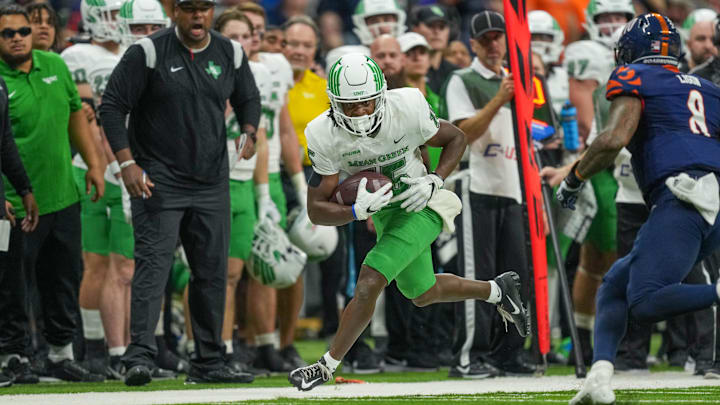 Dec 2, 2022; San Antonio, Texas, USA;  North Texas Mean Green wide receiver Jordan Smart (15) runs the ball in the first half against the UTSA Roadrunners at the Alamodome. Mandatory Credit: Daniel Dunn-Imagn Images