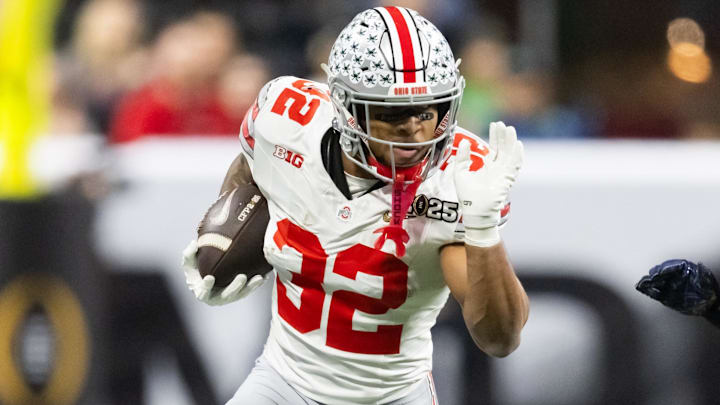Jan 20, 2025; Atlanta, GA, USA; Ohio State Buckeyes running back TreVeyon Henderson (32) against the Notre Dame Fighting Irish during the CFP National Championship college football game at Mercedes-Benz Stadium. 