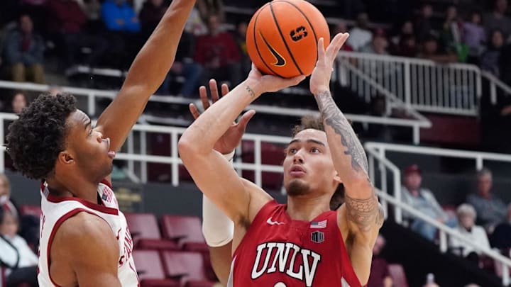  UNLV Runnin' Rebels guard Dra Gibbs-Lawhorn (0) shoots against Stanford Cardinal guard Ebuka Okorie (1) in the second half at Maples Pavilion. Mandatory Credit: David Gonzales-Imagn Images