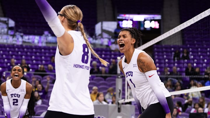 Nov. 20, 2024-Alexis Roberson (1), Evan Hendrix (2) and Stephanie Young (8) celebrate as TCU volleyball beat Houston in Schollmaier Arena.