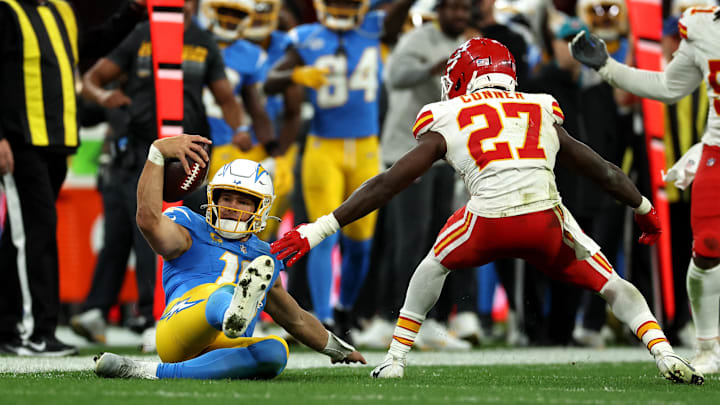 Los Angeles Chargers quarterback Justin Herbert (10) picks up a first down against Kansas City Chiefs