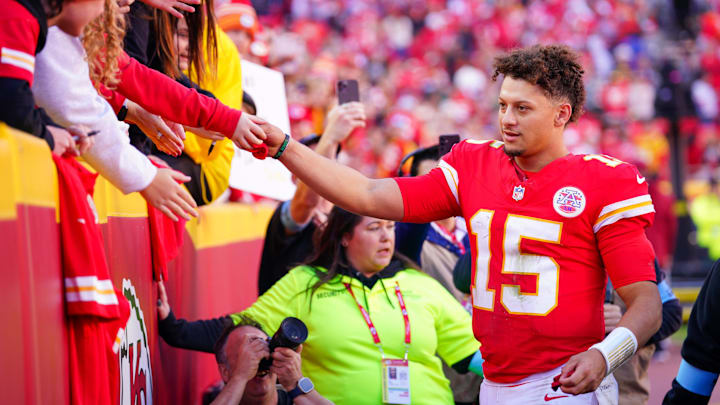 Nov 10, 2024; Kansas City, Missouri, USA; Kansas City Chiefs quarterback Patrick Mahomes (15) greets fans as he leaves the field after the win over the Denver Broncos at GEHA Field at Arrowhead Stadium. Mandatory Credit: Denny Medley-Imagn Images