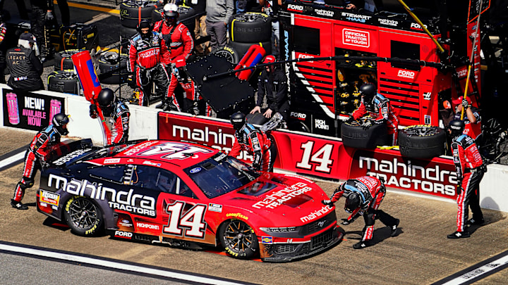 Chase Briscoe's No. 14 Stewart-Haas Racing team makes a pit stop during the 2024 GEICO 500 NASCAR Cup Series race at Talladega Superspeedway.