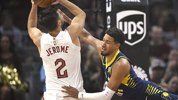 Oct 10, 2024; Cleveland, Ohio, USA; Indiana Pacers guard Tyrese Haliburton (0) defends Cleveland Cavaliers guard Ty Jerome (2) in the first quarter at Rocket Mortgage FieldHouse. Mandatory Credit: David Richard-Imagn Images