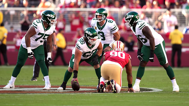 Sep 9, 2024; Santa Clara, California, USA; New York Jets quarterback Aaron Rodgers (8) talks with guards Alijah Vera-Tucker (75) and John Simpson (76) and center Joe Tippmann (66) before a snap against the San Francisco 49ers during the first quarter at Levi's Stadium. Sep 9, 2024; Santa Clara, California, USA; New York Jets quarterback Aaron Rodgers (8) talks with guards Alijah Vera-Tucker (75) and John Simpson (76) and center Joe Tippmann (66) before a snap against the San Francisco 49ers during the first quarter at Levi's Stadium.