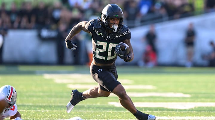 Oct 12, 2024; Eugene, Oregon, USA; Oregon Ducks running back Jordan James (20) runs the ball during the first quarter against the Ohio State Buckeyes at Autzen Stadium.