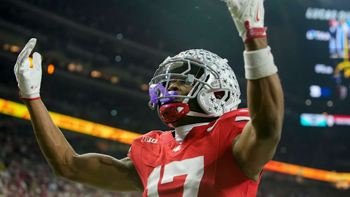 Ohio State Buckeyes wide receiver Carnell Tate (17) celebrates a touchdown Saturday, Dec. 6, 2025, during the Big Ten football championship against the Indiana Hoosiers at Lucas Oil Stadium in Indianapolis.