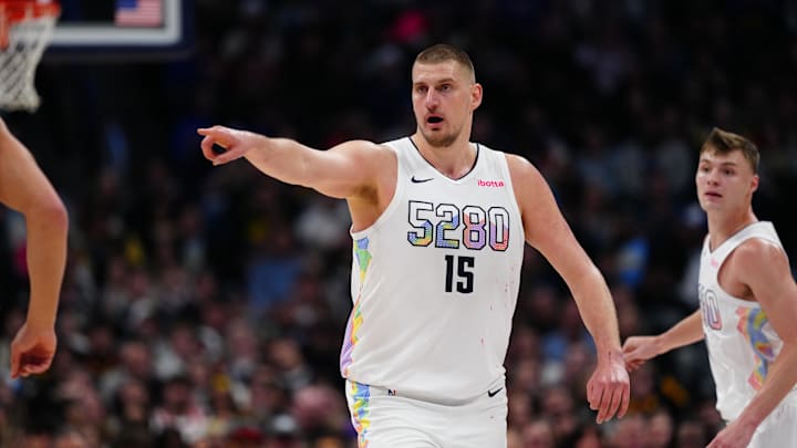 Denver Nuggets center Jokic points in the second half against the Phoenix Suns at Ball Arena. 