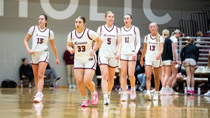 The Dowling Catholic starting line up returns to the floor after a timeout on Friday, Jan. 10, 2025, at Dowling Catholic High School.
