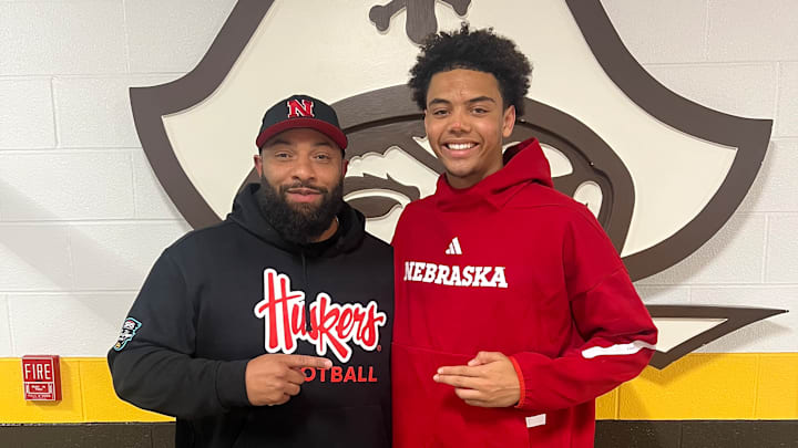 Nebraska running backs coach E.J. Barthel with 2027 quarterback commit Trae Taylor.