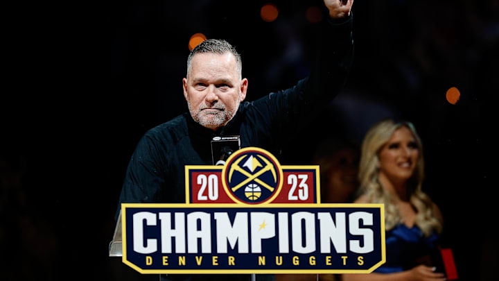 Oct 24, 2023; Denver, Colorado, USA: Denver Nuggets head coach Michael Malone holds up his NBA Championship ring before the game against the Los Angeles Lakers at Ball Arena. Mandatory Credit: Isaiah J. Downing-Imagn Images Oct 24, 2023; Denver, Colorado, USA: Denver Nuggets head coach Michael Malone holds up his NBA Championship ring before the game against the Los Angeles Lakers at Ball Arena. Mandatory Credit: Isaiah J. Downing-Imagn Images