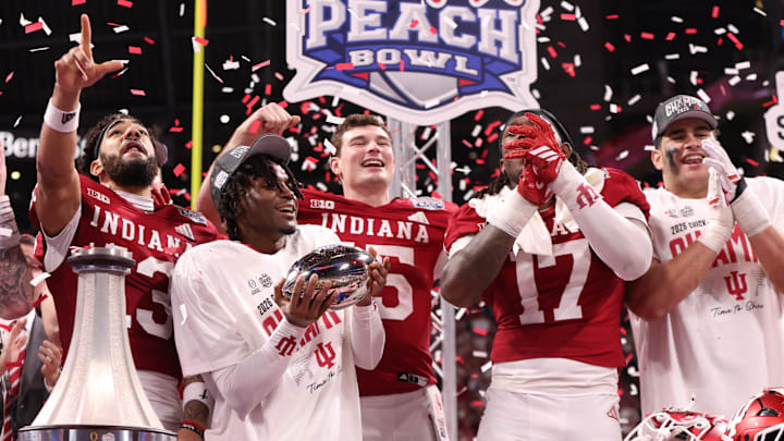 Indiana Hoosiers defensive back D'Angelo Ponds (5) holds the trophy on stage after the 2025 Peach Bowl