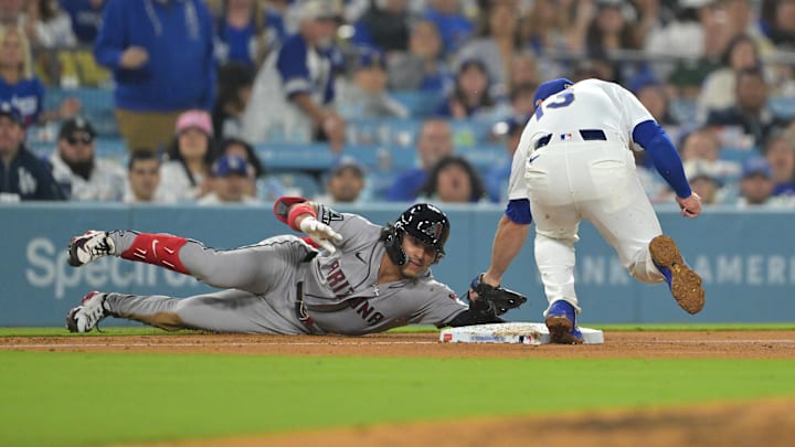 Mar 27, 2026; Los Angeles, California, USA; Arizona Diamondbacks center fielder Alek Thomas (5) is out against Los Angeles Dodgers third baseman Max Muncy (13) in the fourth inning at Dodger Stadium. Mandatory Credit: Jayne Kamin-Oncea-Imagn Images