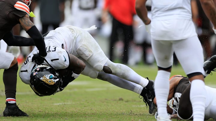 Jacksonville Jaguars running back Travis Etienne Jr. (1) is tackled by Cleveland Browns cornerback Cameron Mitchell (29) during the fourth quarter of an NFL football matchup Sunday, Sept. 15, 2024 at EverBank Stadium in Jacksonville, Fla. The Browns defeated the Jaguars 18-13. [Corey Perrine/Florida Times-Union]