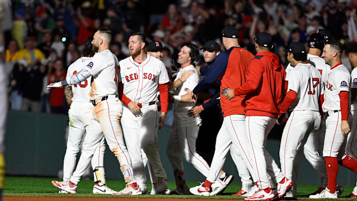 Sep 17, 2025; Boston, Massachusetts, USA; Boston Red Sox first baseman Nick Sogard (20) (center) celebrates his walk-off RBI during the tenth inning against the Athletics at Fenway Park. Mandatory Credit: Eric Canha-Imagn Images