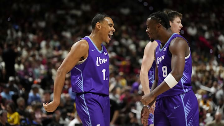 Jul 14, 2025; Las Vegas, NV, USA; Utah Jazz forward John Tonje (17) celebrates with guard Isaiah Collier (8) after scoring against the San Antonio Spurs during the second half of a NBA basketball game at the Thomas & Mack Center. Mandatory Credit: Lucas Peltier-Imagn Images