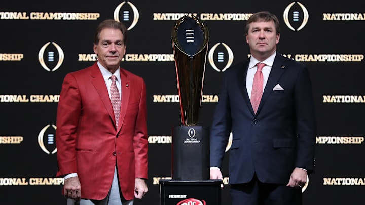 Jan 7, 2018; Atlanta, GA, USA; Alabama Crimson Tide head coach Nick Saban (left) poses for a photo with Georgia Bulldogs head coach Kirby Smart and College Football Playoff National Championship Trophy at Sheraton Atlanta. Mandatory Credit: Matthew Emmons-Imagn Images Jan 7, 2018; Atlanta, GA, USA; Alabama Crimson Tide head coach Nick Saban (left) poses for a photo with Georgia Bulldogs head coach Kirby Smart and College Football Playoff National Championship Trophy at Sheraton Atlanta. Mandatory Credit: Matthew Emmons-Imagn Images