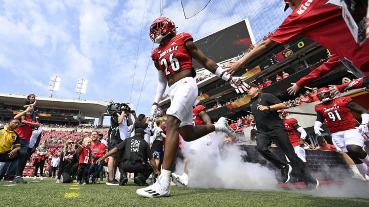 Sep 24, 2022; Louisville, Kentucky, USA; Louisville Cardinals safety M.J. Griffin (26) leads the team to the field before the first quarter against the South Florida Bulls at Cardinal Stadium. Sep 24, 2022; Louisville, Kentucky, USA; Louisville Cardinals safety M.J. Griffin (26) leads the team to the field before the first quarter against the South Florida Bulls at Cardinal Stadium.