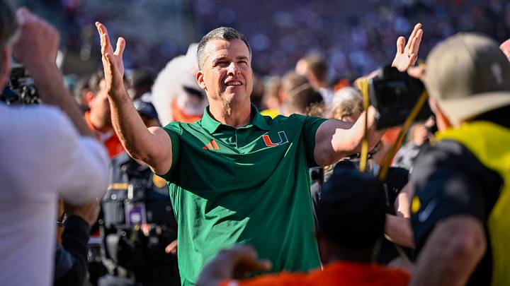 Dec 20, 2025; College Station, TX, USA; Miami Hurricanes head coach Mario Cristobal celebrates as he walks off the field after the Hurricanes win over the Texas A&M Aggies at Kyle Field. Mandatory Credit: Jerome Miron-Imagn Images
