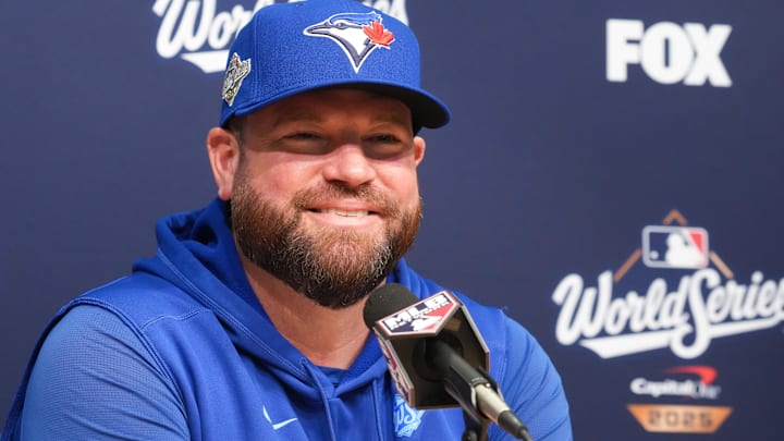 Oct 29, 2025; Los Angeles, California, USA; Toronto Blue Jays manager John Schneider (14) speaks at the pregame press conference before game five of the 2025 MLB World Series at Dodger Stadium. 