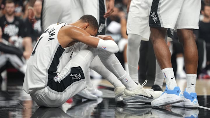 Apr 21, 2026; San Antonio, Texas, USA; San Antonio Spurs forward Victor Wembanyama (1) reacts after falling to the ground during the first half of game two of the first round of the 2026 NBA Playoffs against the Portland Trail Blazers at Frost Bank Center. Mandatory Credit: Scott Wachter-Imagn Images