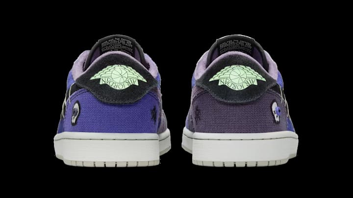 The Zion x Air Jordan 1 Low OG 'Regency Purple and Dark Raisin' colorway. The Zion x Air Jordan 1 Low OG 'Regency Purple and Dark Raisin' colorway.