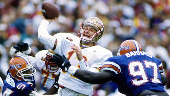 Nov 25, 1995; Gainesville, FL, USA; FILE PHOTO; Florida State Seminoles quarter back Danny Kanell (13) throwing the ball in action against the Florida Gators at Ben Hill Griffin Stadium. Mandatory Credit: Imagn Images 