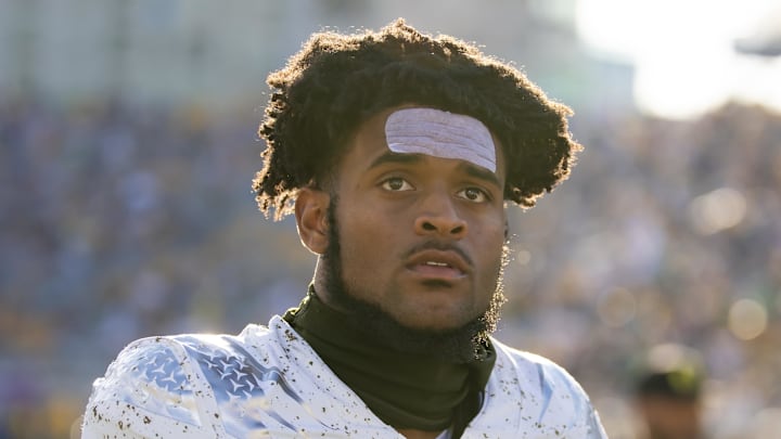 Oregon Ducks star wide receiver Traeshon Holden was ejected from Saturday night's game against Ohio State after he spit on an opponent.