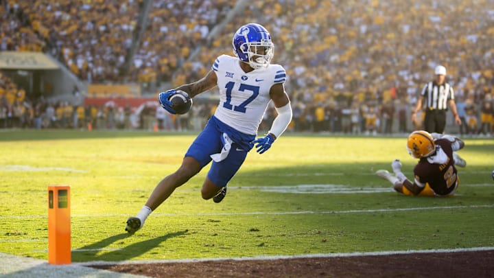 Nov 23, 2024; Tempe, Arizona, USA; Brigham Young Cougars wide receiver Keelan Marion (17) scores a touchdown against the Arizona State Sun Devils at Mountain America Stadium. Mandatory Credit: Mark J. Rebilas-Imagn Images Nov 23, 2024; Tempe, Arizona, USA; Brigham Young Cougars wide receiver Keelan Marion (17) scores a touchdown against the Arizona State Sun Devils at Mountain America Stadium. Mandatory Credit: Mark J. Rebilas-Imagn Images