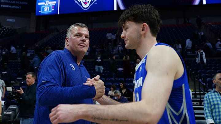 Creighton Bluejays head coach Greg McDermott congratulates guard Hudson Greer (10) after defeating the UConn Huskies at Harry A. Gampel Pavilion. Creighton Bluejays head coach Greg McDermott congratulates guard Hudson Greer (10) after defeating the UConn Huskies at Harry A. Gampel Pavilion.