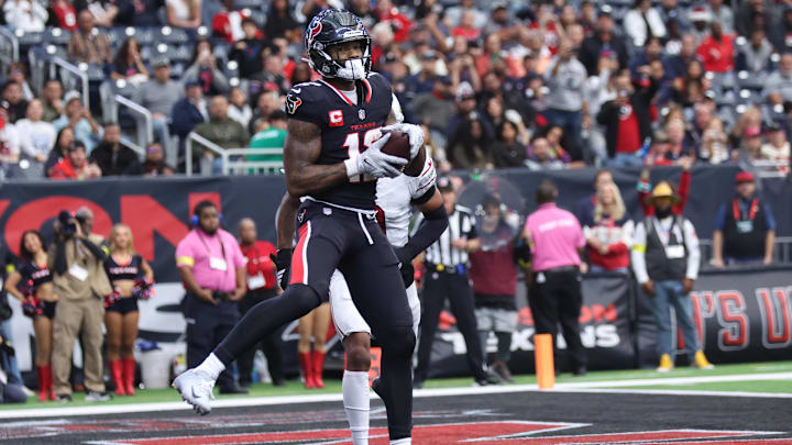 Dec 14, 2025; Houston, Texas, USA; Houston Texans wide receiver Nico Collins (12) catches a touchdown pass during the fourth quarter against the Arizona Cardinals at NRG Stadium. Mandatory Credit: Troy Taormina-Imagn Images