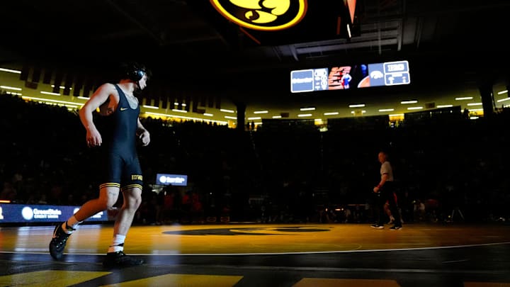 Iowa’s Joey Cruz prepares to wrestle Oklahoma State's Troy Spratley in a 125-pound match Sunday, Feb. 23, 2025 at Carver-Hawkeye Arena in Iowa City, Iowa.