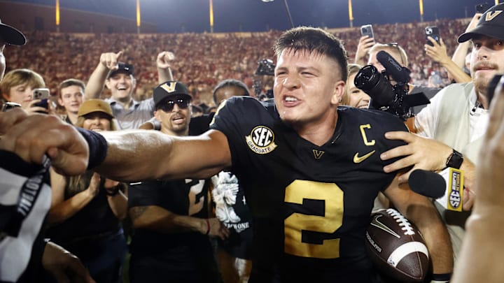 Oct 5, 2024; Nashville, Tennessee, USA;  Vanderbilt Commodores quarterback Diego Pavia celebrates with fans after defeating the Alabama Crimson Tide during the second half at FirstBank Stadium. Mandatory Credit: Butch Dill-Imagn Images
