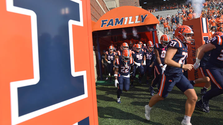 Oct 12, 2024; Champaign, Illinois, USA;  The Illinois Fighting Illini take the field in the first half against the Purdue Boilermakers at Memorial Stadium. Mandatory Credit: Ron Johnson-Imagn Images