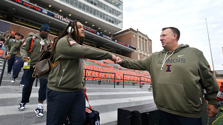 Nov 15, 2025; Champaign, Illinois, USA;  Illinois Fighting Illini head coach Bret Bielema greets players.