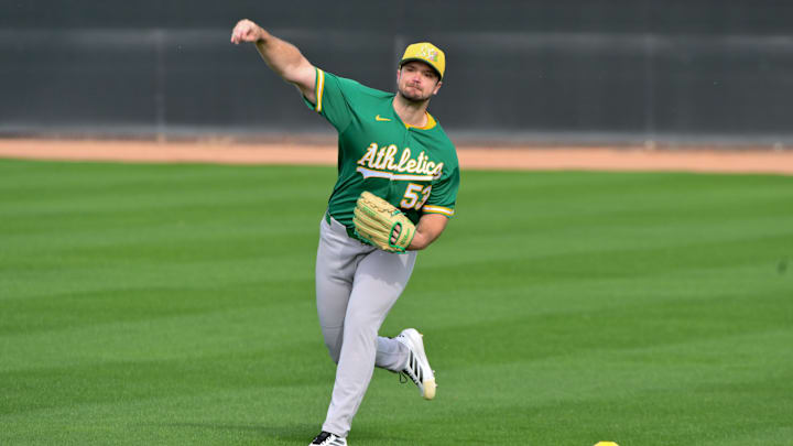 Feb 11, 2026; Mesa, AZ, USA;  Athletics pitcher Gunnar Hoglund (53) throws during a Spring Training workout at HoHhokum stadium. Mandatory Credit: Matt Kartozian-Imagn Images