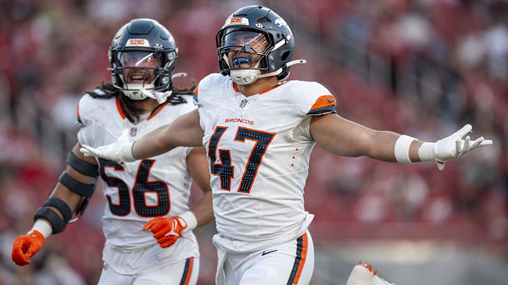 August 9, 2025; Santa Clara, California, USA; Denver Broncos linebacker Karene Reid (47) celebrates intercepting the football with linebacker Levelle Bailey (56) against the San Francisco 49ers during the second quarter at Levi's Stadium. Mandatory Credit: Kyle Terada-Imagn Images