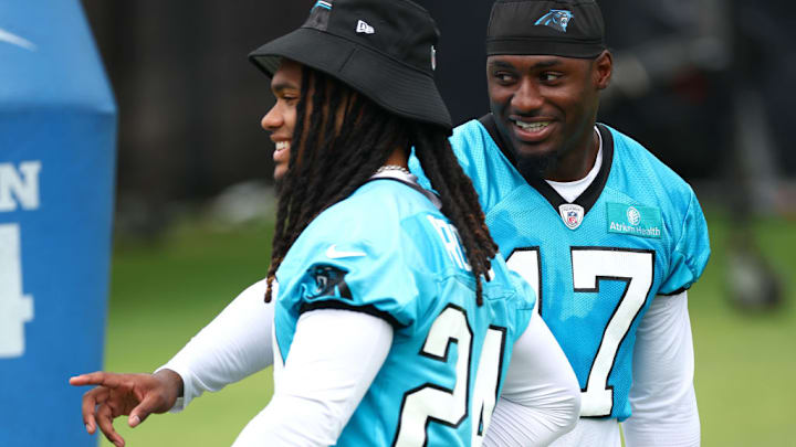 CHARLOTTE, NORTH CAROLINA - JUNE 04: Jonathon Brooks #24 and Xavier Legette #17 of the Carolina Panthers attend Carolina Panthers OTA Offseason Workout on June 04, 2024 in Charlotte, North Carolina.